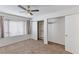 Bright bedroom with carpet flooring, a ceiling fan, a window, and a closet with sliding doors at 5265 Caspian Springs Dr # 201, Las Vegas, NV 89120