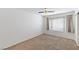 Bright bedroom with carpet flooring, a window with curtains, and white walls at 5265 Caspian Springs Dr # 201, Las Vegas, NV 89120