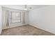 Neutral bedroom with a large window and carpeted floors at 5265 Caspian Springs Dr # 201, Las Vegas, NV 89120