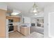 Bright kitchen featuring ample counter space, modern appliances, and a stylish hanging light fixture at 5265 Caspian Springs Dr # 201, Las Vegas, NV 89120