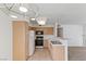 Well-lit kitchen with modern appliances, wood cabinets, and an open view to the living space at 5265 Caspian Springs Dr # 201, Las Vegas, NV 89120
