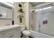 Bathroom featuring gray vanity, modern fixtures, and shower with glass doors at 5309 Silverheart Ave, Las Vegas, NV 89142