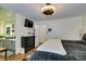 Primary bedroom featuring a ceiling fan, modern furnishings, and an en suite bathroom and walk-in closet at 5309 Silverheart Ave, Las Vegas, NV 89142