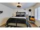 Comfortable primary bedroom featuring a decorative ceiling fan, accent wall art, and modern furnishings at 5309 Silverheart Ave, Las Vegas, NV 89142