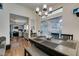 Bright dining room with view to the kitchen and sliding glass doors at 5309 Silverheart Ave, Las Vegas, NV 89142