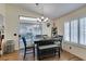Dining area featuring a modern chandelier and sliding doors to the outdoors at 5309 Silverheart Ave, Las Vegas, NV 89142