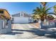 Inviting single-story home with a two-car garage, desert landscaping, and a well-kept exterior at 5309 Silverheart Ave, Las Vegas, NV 89142