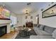 Bright living room showcasing a fireplace, shutters, and cozy seating area at 5309 Silverheart Ave, Las Vegas, NV 89142