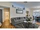 Comfortable living room with a large sectional sofa, stylish decor, and an open doorway to the bathroom at 5309 Silverheart Ave, Las Vegas, NV 89142