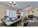Spacious living area with dining table, fireplace, and comfortable seating at 5309 Silverheart Ave, Las Vegas, NV 89142