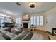 Spacious living room with a fireplace, modern decor, and an open layout perfect for gatherings at 5309 Silverheart Ave, Las Vegas, NV 89142