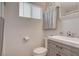 Clean bathroom with white fixtures, a modern vanity, and a well-lit mirror at 533 K Ave, Boulder City, NV 89005