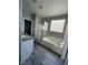 Bathroom featuring a bathtub, walk-in shower and granite countertop vanity providing a luxurious experience at 5721 Heineken Dr, North Las Vegas, NV 89031