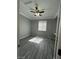 Bedroom featuring a ceiling fan, window, and closet, providing a comfortable and functional space at 5721 Heineken Dr, North Las Vegas, NV 89031