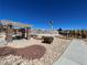 Community area featuring a playground, desert landscaping, pergola with columns, and pool area at 5721 Heineken Dr, North Las Vegas, NV 89031