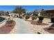 Beautifully landscaped community area with walking path, playground, and well-maintained greenery at 5721 Heineken Dr, North Las Vegas, NV 89031