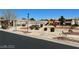 Community area with a playground, grassy spots, sidewalks, and landscaped common area at 5721 Heineken Dr, North Las Vegas, NV 89031