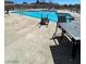 Community pool and surrounding area has lounge chairs and tables for residents to enjoy at 5721 Heineken Dr, North Las Vegas, NV 89031