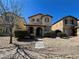 Charming two-story home with well-maintained landscaping, including bushes and desert stone at 5721 Heineken Dr, North Las Vegas, NV 89031