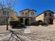 Charming two-story home featuring manicured front yard, desert landscaping, and covered porch at 5721 Heineken Dr, North Las Vegas, NV 89031