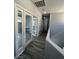 Second floor hallway with natural light and office view, creating an inviting and functional space at 5721 Heineken Dr, North Las Vegas, NV 89031