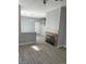 Open concept living room with fireplace and view of staircase to the upper level at 5721 Heineken Dr, North Las Vegas, NV 89031
