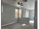Spacious living room featuring gray wood floors, modern paint, and bright natural light at 5721 Heineken Dr, North Las Vegas, NV 89031