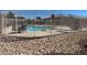 Community pool with lounge chairs, perfect for relaxation and recreation in the neighborhood at 5721 Heineken Dr, North Las Vegas, NV 89031