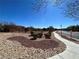 Wide view of a walking path in a community area with desert landscaping and neighborhood homes at 5721 Heineken Dr, North Las Vegas, NV 89031
