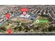 An aerial view of Lee Antonello Elementary School and Eldorado Park in a dense residential neighborhood near Tropical Parkway at 5850 Grey Wood Way, North Las Vegas, NV 89031