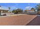 Spacious backyard featuring rock landscaping and a covered patio area at 5850 Grey Wood Way, North Las Vegas, NV 89031