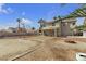 Expansive backyard with open space and a charming fire pit area at 5850 Grey Wood Way, North Las Vegas, NV 89031
