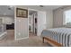Inviting bedroom with neutral walls and a view of an en-suite bathroom at 5850 Grey Wood Way, North Las Vegas, NV 89031