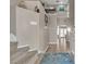 Two-story foyer featuring a staircase, tile flooring, and natural light from the entry door at 5850 Grey Wood Way, North Las Vegas, NV 89031