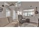 Comfortable living room featuring neutral tones, large windows, and an open floor plan at 5850 Grey Wood Way, North Las Vegas, NV 89031