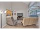 Relaxing living space featuring a large window, a comfortable sofa, and a TV at 5850 Grey Wood Way, North Las Vegas, NV 89031