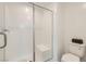 Clean bathroom with a tiled shower stall, a built-in seat, and modern fixtures for a spa-like experience at 6178 Foxes Dale St, Las Vegas, NV 89166