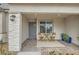 Cozy front porch with table and chairs, offering a relaxing outdoor space at 6178 Foxes Dale St, Las Vegas, NV 89166