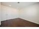 An empty bedroom showcasing hardwood floors, a large double door closet, and recessed lighting at 6284 Pinewood Ave, Las Vegas, NV 89103