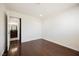 Bedroom with hardwood floors leading to an ensuite bathroom, highlighting convenience and style at 6284 Pinewood Ave, Las Vegas, NV 89103