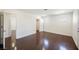 This bedroom features wood floors, a closet, and neutral paint at 6284 Pinewood Ave, Las Vegas, NV 89103