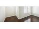 Entryway featuring dark hardwood flooring, white trim, and a bright window near the front door at 6284 Pinewood Ave, Las Vegas, NV 89103