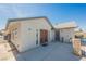 Exterior view of the home showcasing a covered patio area with access from the backyard at 6284 Pinewood Ave, Las Vegas, NV 89103