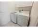 This laundry room features a white washer and dryer with white cabinets above at 6284 Pinewood Ave, Las Vegas, NV 89103