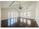 Spacious living room with vaulted ceilings, dark hardwood floors, and lots of natural light at 6284 Pinewood Ave, Las Vegas, NV 89103