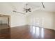 Spacious living room with vaulted ceilings, dark hardwood floors, and French doors at 6284 Pinewood Ave, Las Vegas, NV 89103