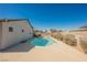 Outdoor view of the sparkling pool with a surrounding patio and mature landscaping at 6284 Pinewood Ave, Las Vegas, NV 89103