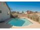 Outdoor pool with clean, clear water, surrounded by a concrete patio and privacy landscaping at 6284 Pinewood Ave, Las Vegas, NV 89103