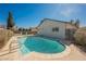 Backyard pool with a ladder for easy access and a patio for lounging at 6284 Pinewood Ave, Las Vegas, NV 89103