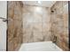 Close-up showcasing the tiled shower and tub, designed for relaxation and comfort at 6284 Pinewood Ave, Las Vegas, NV 89103